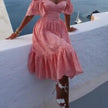 Pink off-shoulder midi dress for women by FJØRNA featuring an elegant A-line design and a stylish, feminine silhouette.