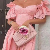 Pink FJØRNA off-shoulder midi dress for women, elegant A-line style with a fitted bodice and flowing skirt.