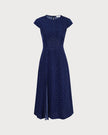 FJØRNA polka dot midi dress for women with round neck and cutout design, showcasing a stylish and feminine dress silhouette.