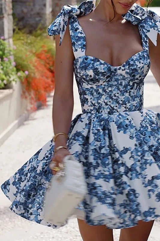 FJØRNA blue floral off-shoulder mini dress for women, elegant party wear with a stylish floral pattern and feminine fit.