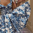 Blue floral off-shoulder mini dress by FJØRNA featuring elegant design, perfect for parties and summer occasions.