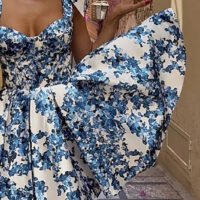 Blue floral off-shoulder mini dress by FJØRNA featuring elegant design, perfect for parties and summer occasions.