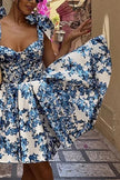 Blue floral off-shoulder mini dress by FJØRNA, elegant party wear with a fitted bodice and flowing skirt.