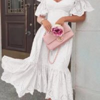 Pink FJØRNA off-shoulder midi dress for women, elegant A-line style, soft fabric, and knee-length design.