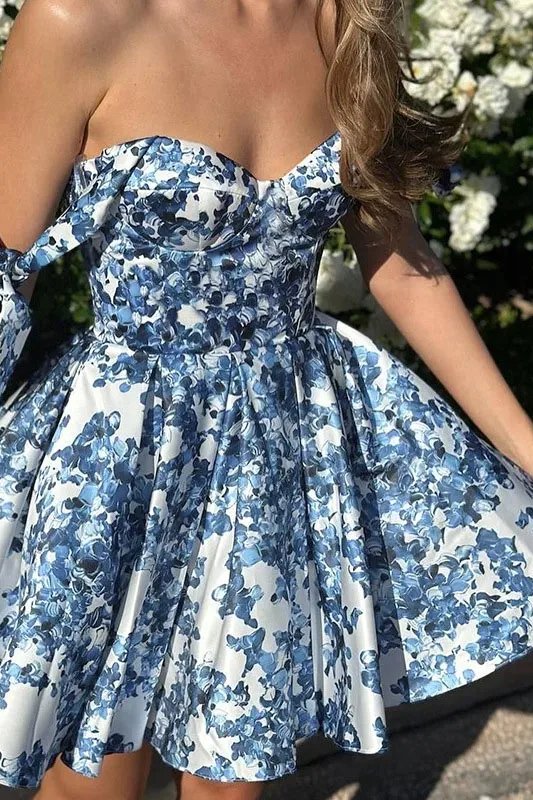 Blue floral off-shoulder mini dress by FJØRNA, elegant party wear with a fitted bodice and flowing skirt, perfect for special occasions.