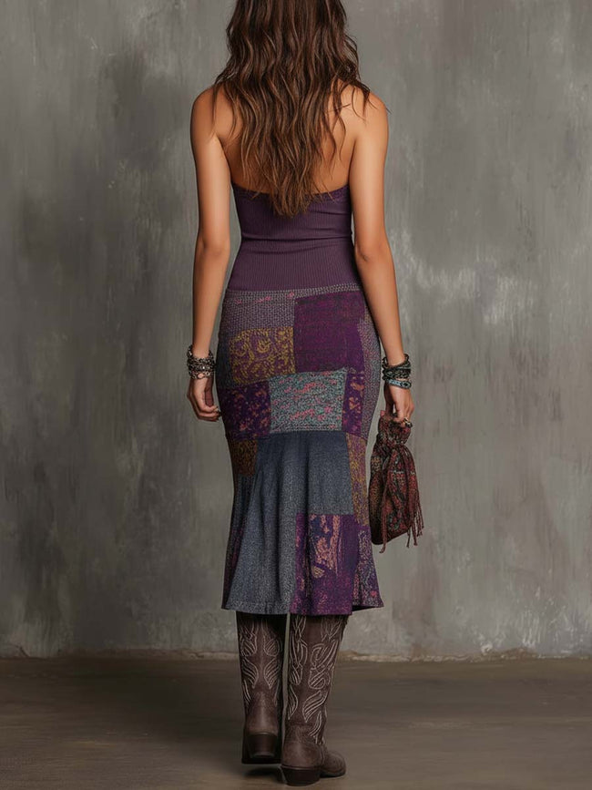 FJØRNA knit halter neck midi dress for women, showcasing a stylish sleeveless design with a fitted waist and midi length.
