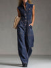Dark blue denim FJØRNA jumpsuit with multi-pocket design, sleeveless balloon silhouette, and casual style.