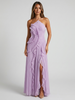 FJØRNA women's pleated halter maxi dress with ruffle details, suitable for wedding guests, in a luxurious fashion style.
