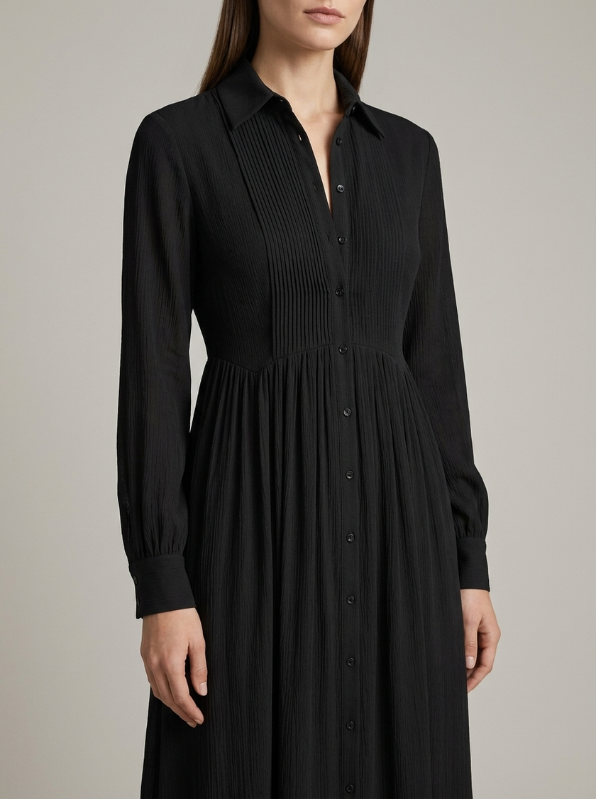Close-up of FJØRNA women's button front maxi dress showing long sleeves and detailed fabric in a summer dress style.