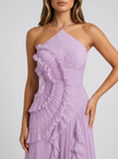 Close-up of FJØRNA women's pleated halter maxi dress with ruffle details, perfect for wedding guest or formal occasions.