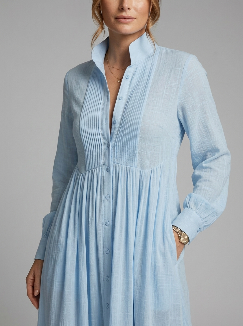 Close-up of FJØRNA women's button-front maxi dress with long sleeves, showcasing detailed fabric and stylish summer dress design.
