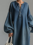 FJØRNA blue denim maxi evening dress with a flowing silhouette and sleeveless design, perfect for elegant occasions.