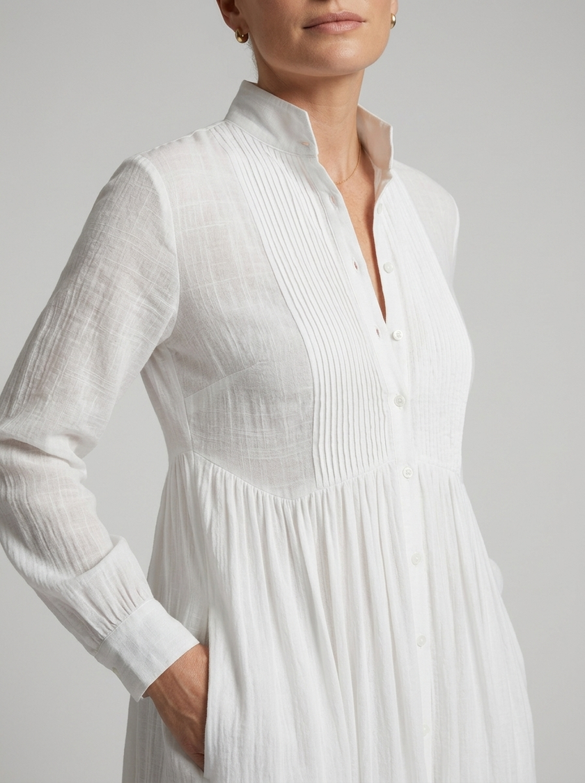 Close-up of FJØRNA women's button-front maxi dress with long sleeves, showcasing the fabric and stylish button details.