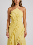 Close-up of FJØRNA women's pleated halter maxi dress with ruffle details, ideal for wedding guest attire.