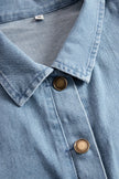 Light blue denim sleeveless jumpsuit with raw edge details and wide-leg design from FJØRNA, shown on a model.