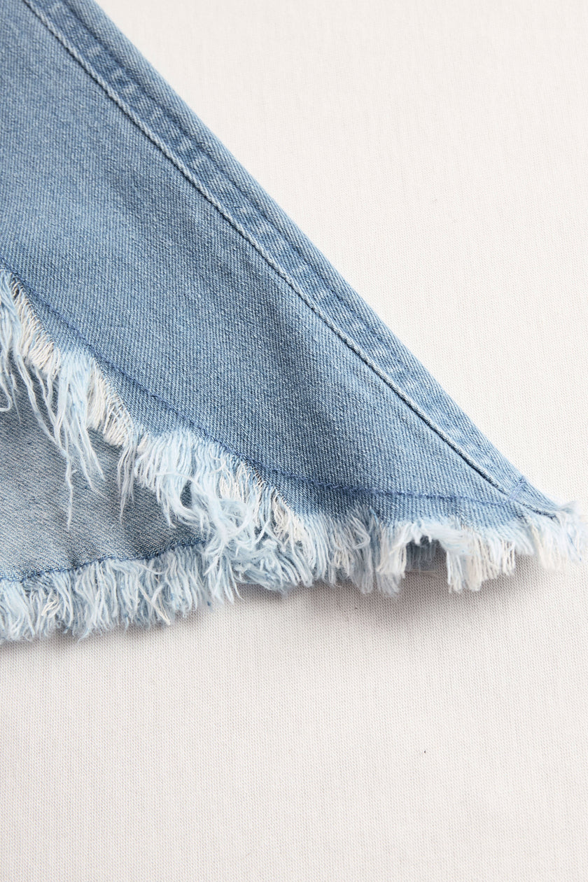Light blue denim sleeveless jumpsuit with raw edges and wide-leg design by FJØRNA, featuring a casual, stylish fit.