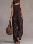 FJØRNA brown retro sleeveless knitted jumpsuit with ruffle neck and ruffled details, stylish and vintage-inspired casual wear.
