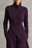 FJØRNA solid color high-neck long-sleeved casual maxi dress with irregular hemline on a model.