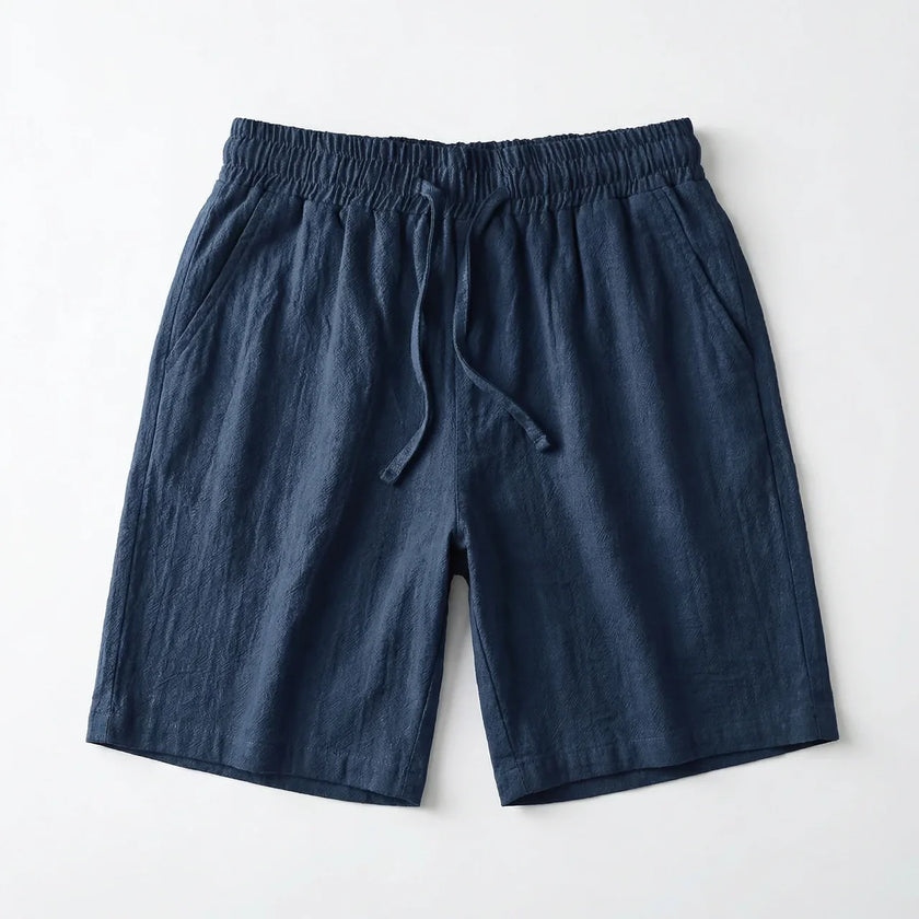 Men's summer linen shorts by FJØRNA, light and breathable fabric, shown in a relaxed fit with casual style.