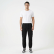 Men's slim fit cotton cargo trousers by FJØRNA, featuring multiple pockets and a modern tapered design.