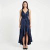 Women's elegant sleeveless wrap midi dress by FJØRNA, showcasing a stylish design with a fitted waist and flowing fabric.