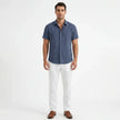 Men's FJØRNA cotton-linen short sleeve shirt, lightweight and breathable, shown in a natural fabric weave with a classic collar and button front.