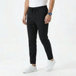 Men's stretchable comfort trousers by FJØRNA, showing a close-up of the black stylish men's pants with a relaxed fit and stretch fabric.