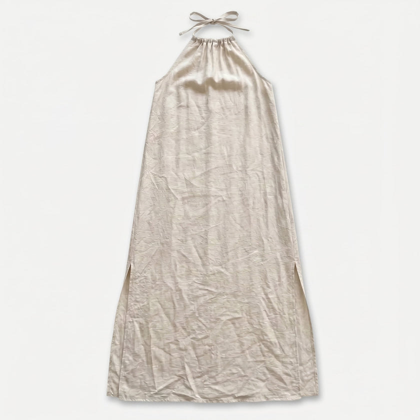 FJØRNA women's sleeveless halter neck summer maxi dress with flowy fabric and waist tie, perfect for warm weather occasions.