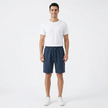 Men's summer linen shorts by FJØRNA, lightweight and breathable, shown in a casual fit with adjustable waist and side pockets.