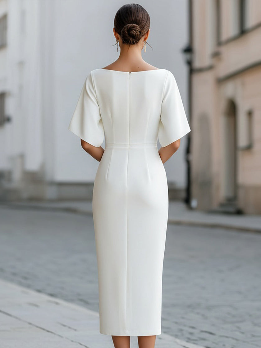 FJØRNA boat neck short sleeve tailored midi dress displayed on a hanger, showcasing its elegant design and smooth fabric.