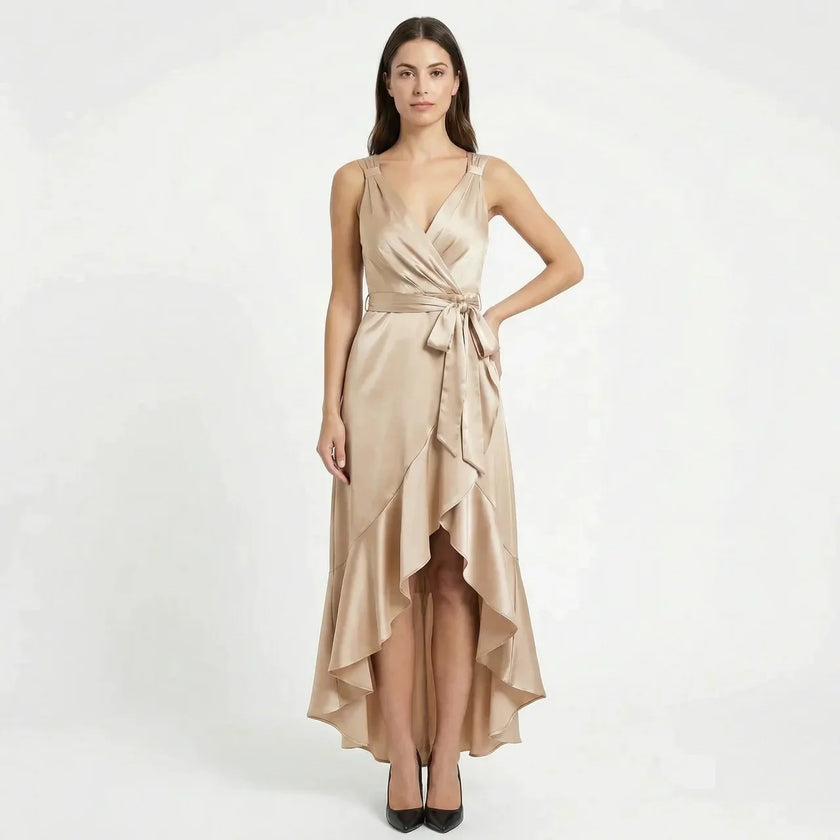 FJØRNA women's elegant sleeveless wrap midi dress hanging on a wooden hanger with a neutral background.