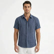 Men's FJØRNA cotton-linen short sleeve shirt displayed on a hanger, featuring a lightweight, breathable fabric and classic collar.