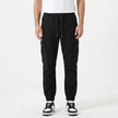 Men's slim fit cotton cargo trousers by FJØRNA, shown in a neutral color, with multiple pockets and a tapered leg fit.
