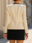 FJØRNA three-piece blazer suit set with contrast trim and gold buttons, featuring a stylish gold dress for women.