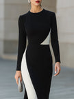FJØRNA modern black and white asymmetric color-block midi dress with stylish design and bold geometric pattern.
