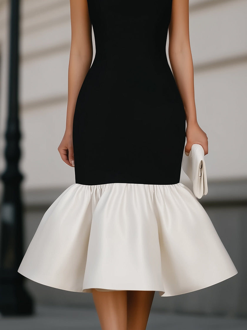 FJØRNA square neck sleeveless midi dress with ruffle hem, showcasing a stylish and elegant dress design.