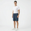 Men's summer linen shorts by FJØRNA, beige lightweight shorts with a drawstring waist and relaxed fit, suitable for warm weather.