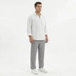 Men's wide-leg summer pants by FJØRNA, lightweight and relaxed fit, shown in a neutral color on a model.