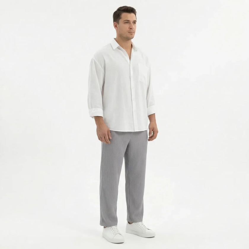 Men's wide-leg summer pants by FJØRNA, lightweight and relaxed fit, shown in a neutral color on a model.