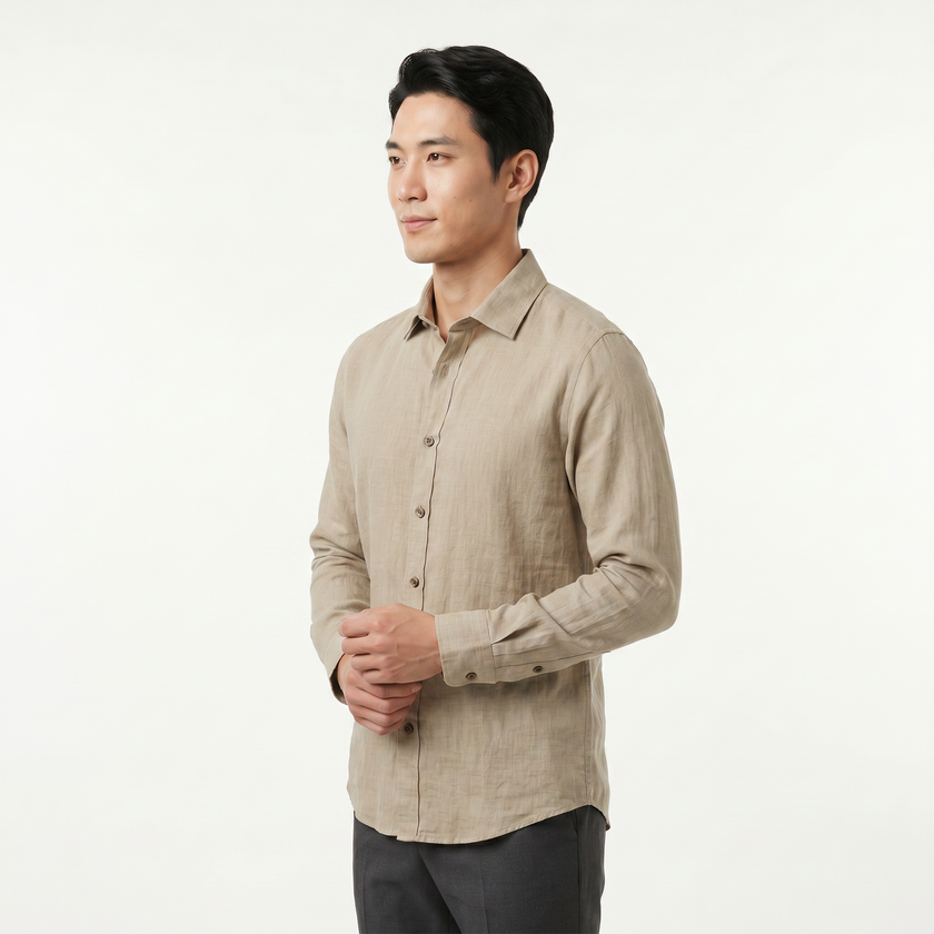 FJØRNA men's long sleeve cotton button-down shirt in light blue, showing collar, buttons, and tailored fit.