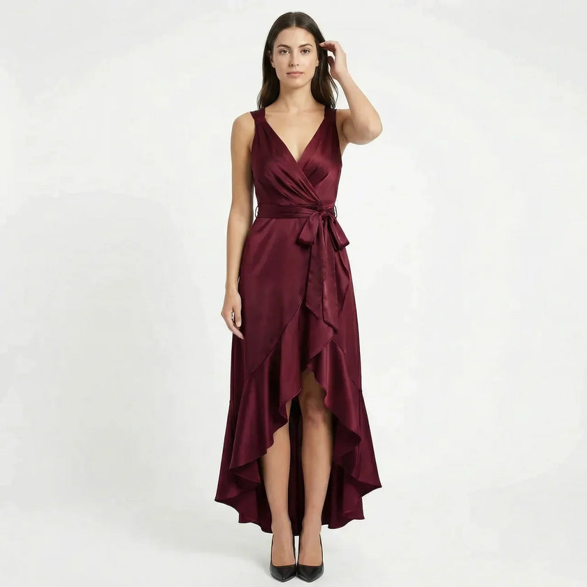 FJØRNA women's sleeveless wrap midi dress with elegant design, showcasing a fitted waist and flowing fabric in a stylish silhouette.