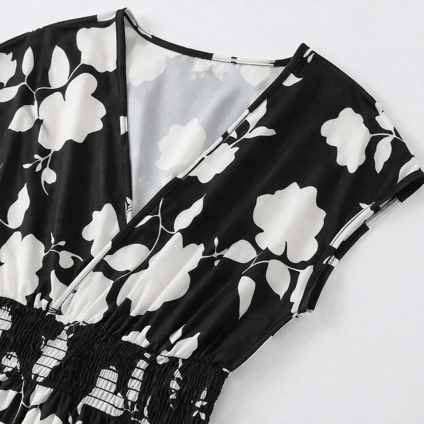 FJØRNA women's floral print V-neck summer maxi dress with flowing fabric and vibrant pattern, perfect for warm weather.