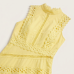 Women's sleeveless lace panel midi dress by FJØRNA, showcasing elegant lace details and a flowing midi silhouette.