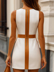 FJØRNA sleeveless faux leather mini dress with brown trim, close-up showing fitted style and stylish detailing.