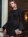 FJØRNA black bell-sleeve floral appliqué mini dress with vibrant floral patterns and stylish bell sleeves.