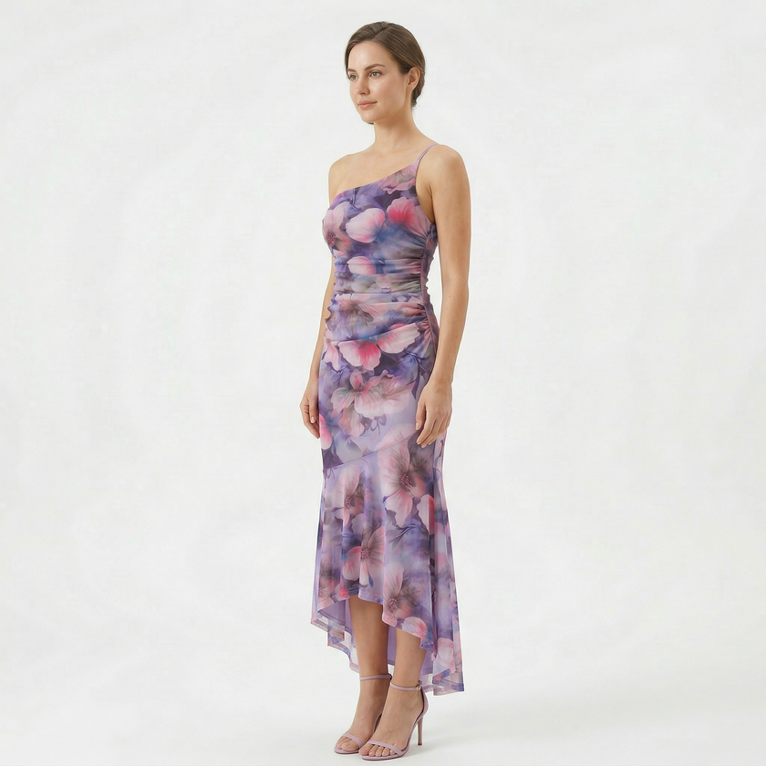 FJØRNA women's floral A-line maxi dress with a flowing silhouette and vibrant flower print, perfect for summer occasions.