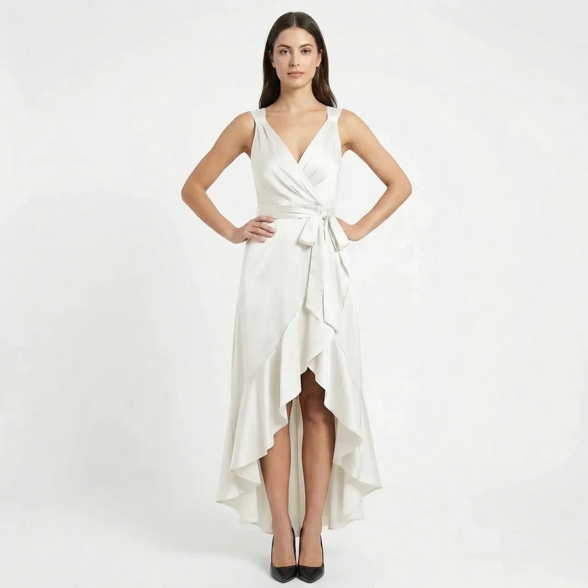 Women's elegant sleeveless wrap midi dress by FJØRNA, shown in a stylish design with a flattering fit and flowing fabric.