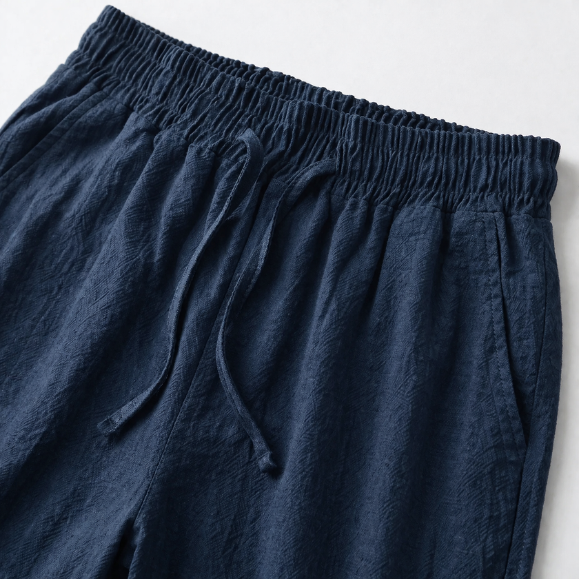 Men's summer linen shorts by FJØRNA, lightweight and breathable, shown in a casual style with a relaxed fit and neutral color.