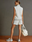 FJØRNA retro sporty grey and white sleeveless sweatshirt and shorts set, half-zip design, casual athletic style.