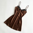 Women's lace slip satin mini dress by FJØRNA, featuring delicate lace details and smooth satin fabric, shown on a mannequin.